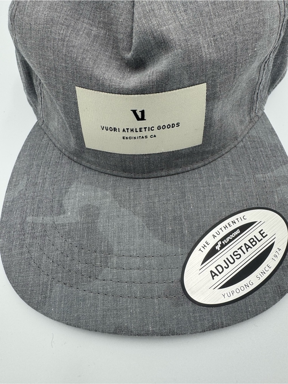 Vuori Gray Five-Panel Adjustable Cap/ Front Patch with faint camo design on brim - Picture 8 of 9